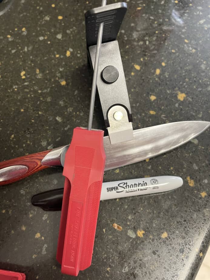 The Lansky or Gatco style sharpener mounted on the knife.