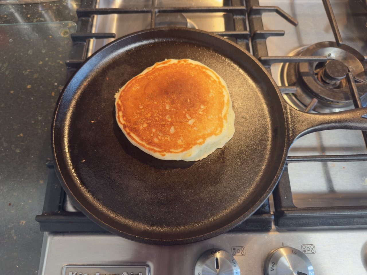 Pancake cooking on cast iron pan