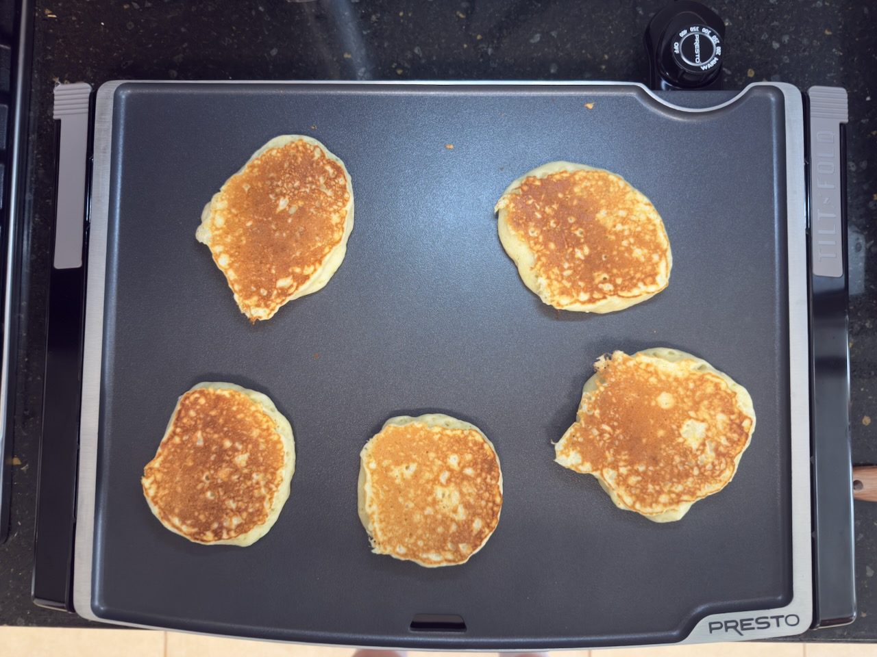 five 6-inch pancakes after turning on ungreased presto griddle cooked nice and even @ 350F